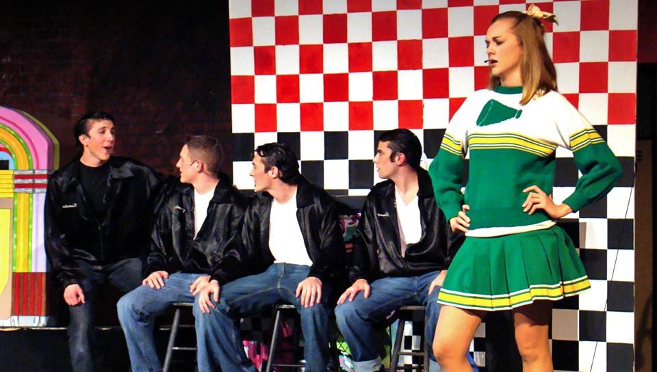 U N E Players performing a song from the play "Grease"